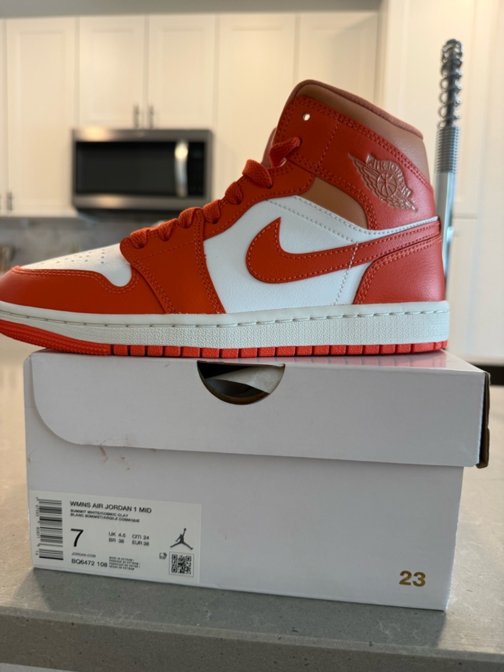 Jordan 1 Mid White and Orange Women's Sneakers